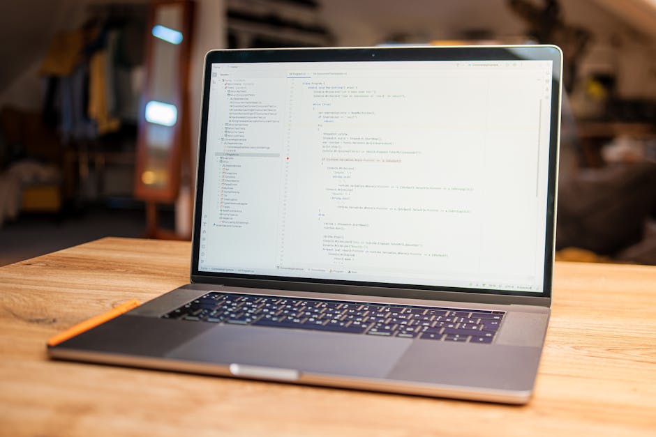 A computer screen displaying a code editor with HTML and CSS code visible, including tags such as <html>, <head>, <title>, and <link>, with syntax highlighting in various color